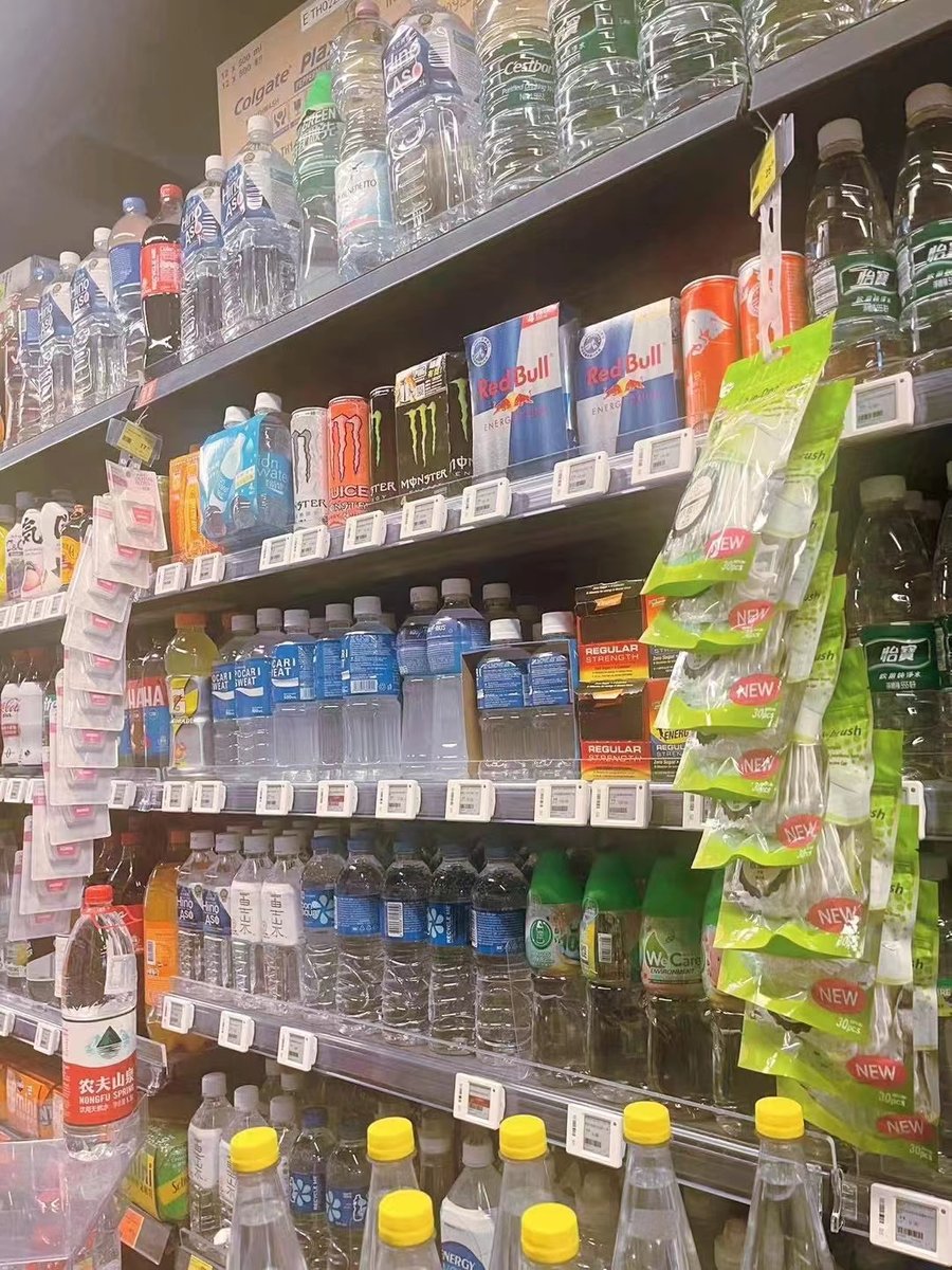 Grocery beverage aisle with electronic shelf labels on every shelf edge