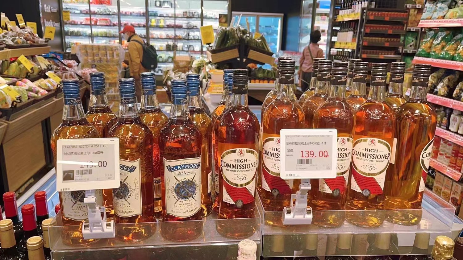 Electronic shelf labels on a supermarket wine and spirits display