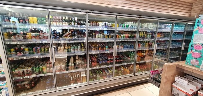 Convenience store refrigeration aisle with electronic price labels