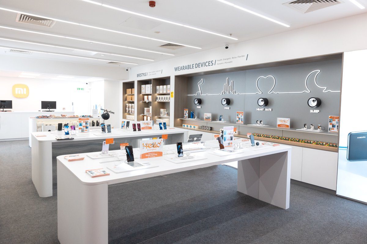 Electronics retail showroom with digital shelf labels